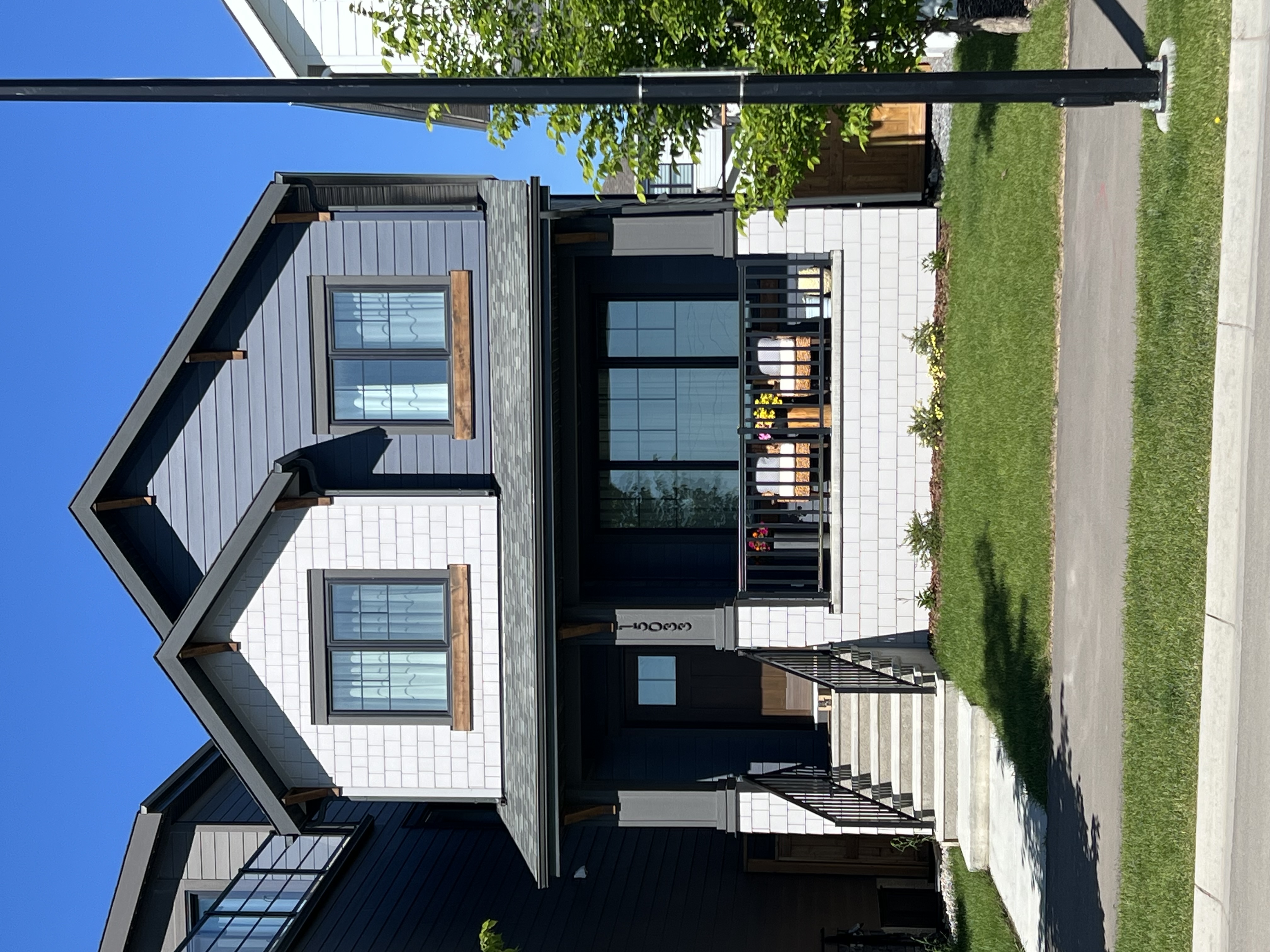 Completed Calgary siding project with trim and wood detail