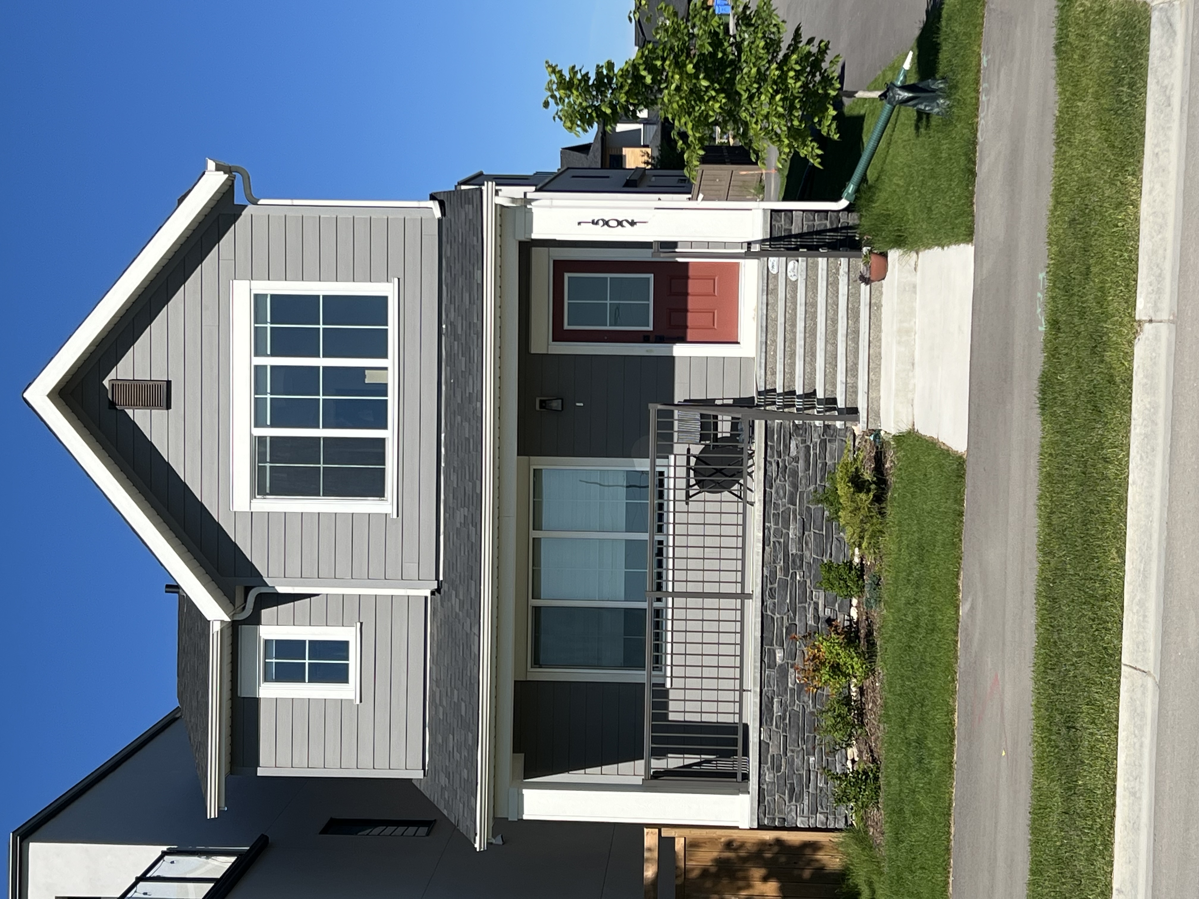 Completed Calgary entry detail with stone and siding finish