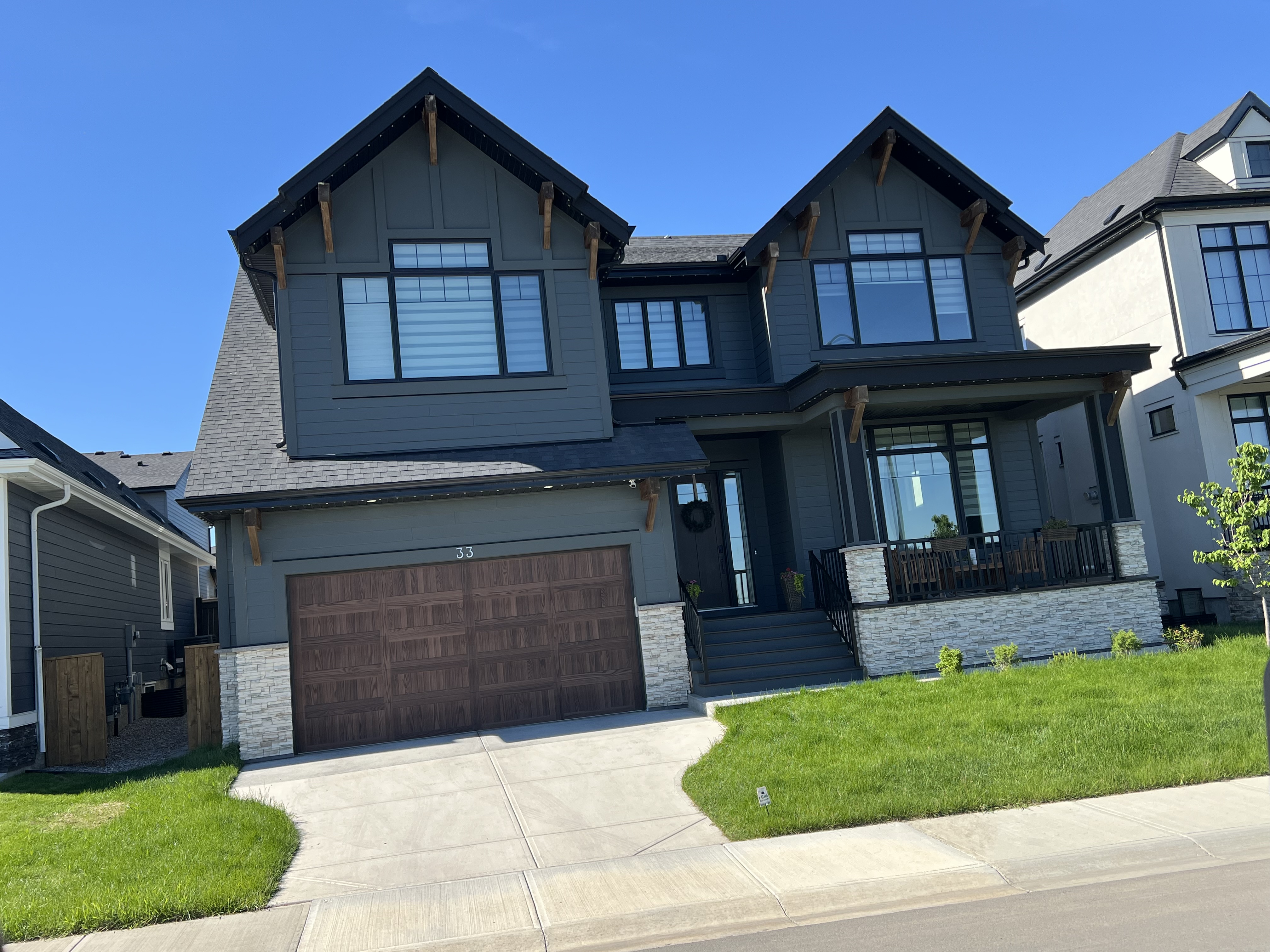 Completed Calgary exterior renovation with garage and front entry detail